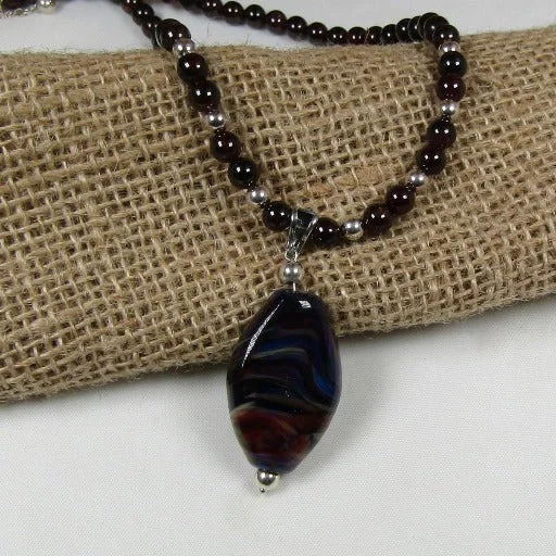 elegant gold pendant with gemstones -Garnet Gemstone Necklace with Black Swirled Artisan Bead Pendant